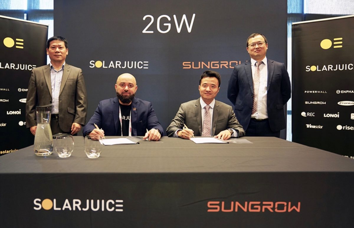 Sungrow Australian country manager Joe Zhou (centre right) and